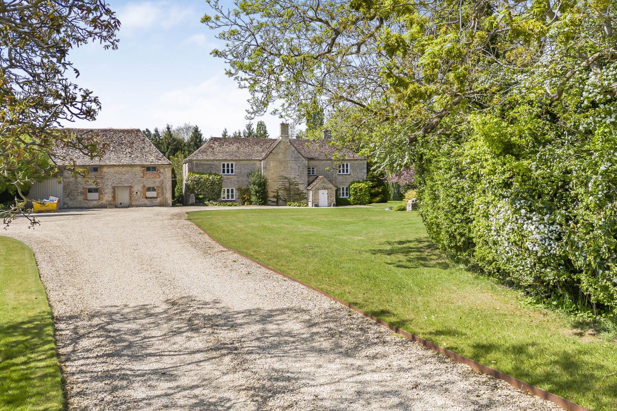 The gravel drive leading to Purwell Farmhouse and its stone outbuildings