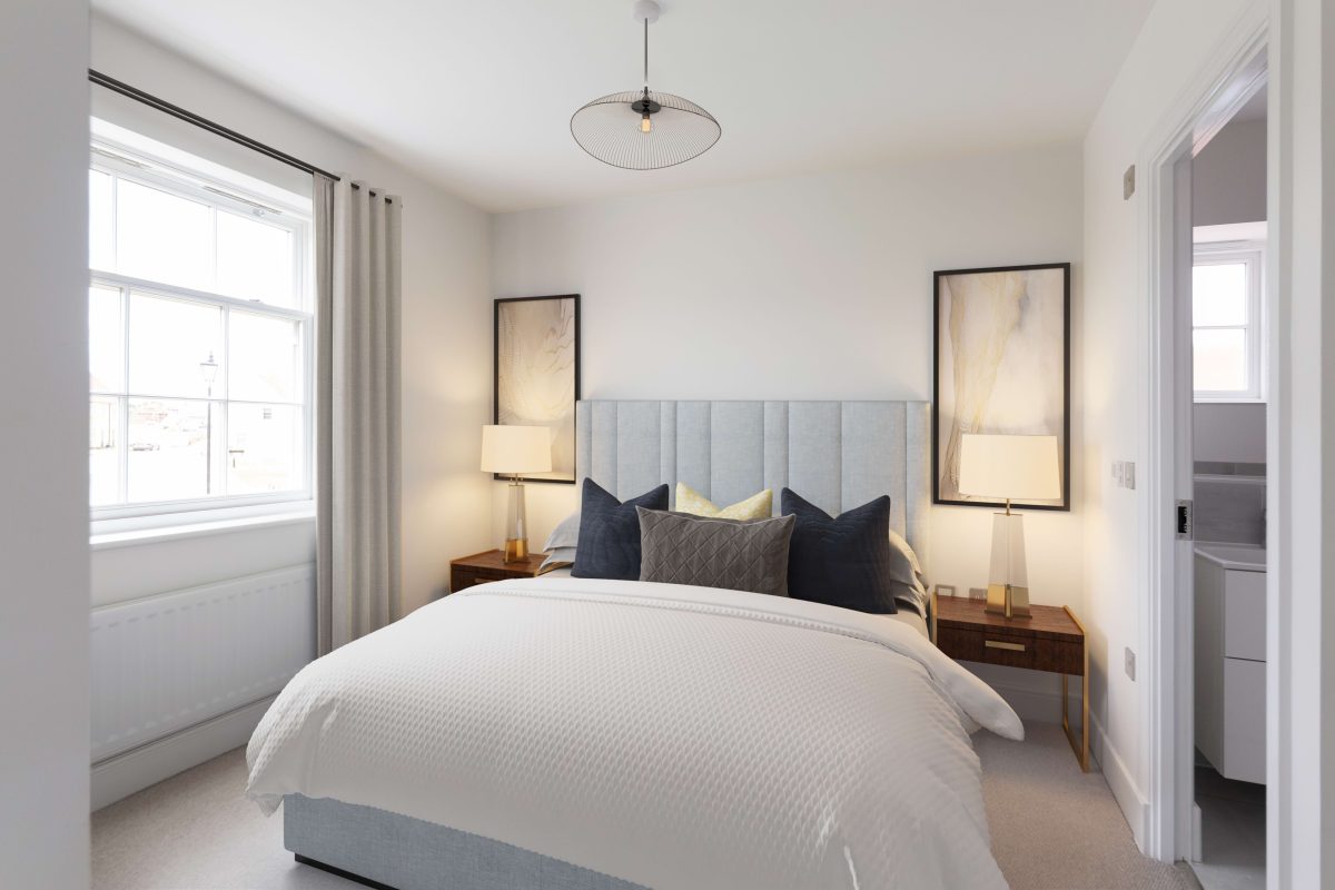 Bedroom with a double bed, upholstered headboard, bedside lamps and a sash window