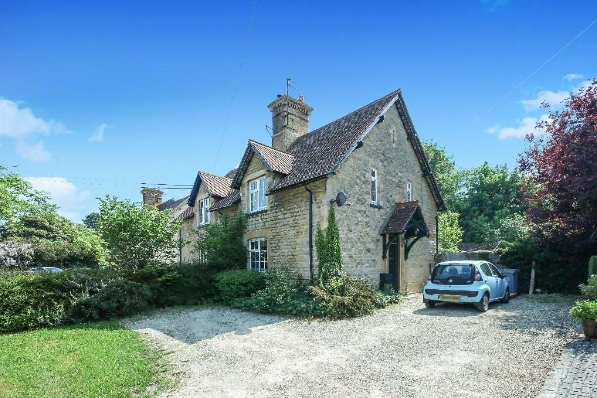 14 Grove Road, a stone semi-detached cottage with a gravel drive