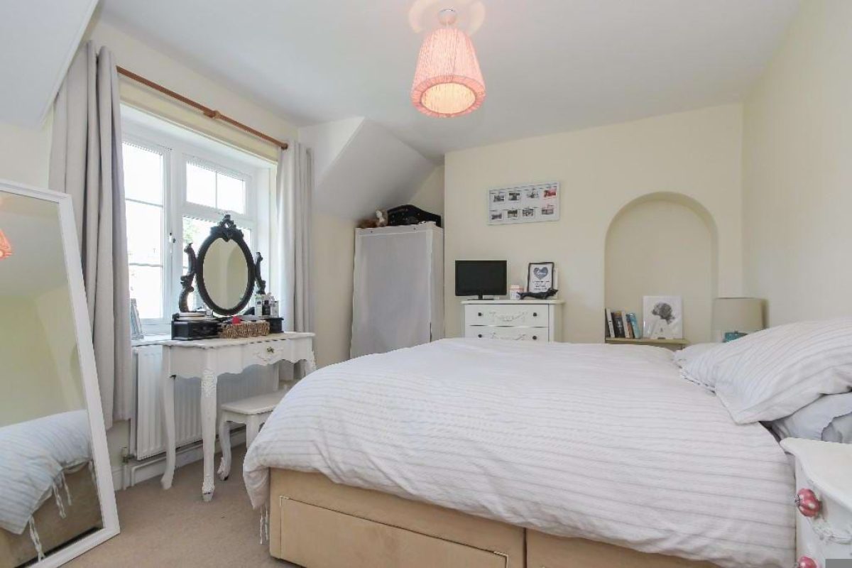 Bedroom at Grove Road with a double bed, dressing table and an alcove shelf