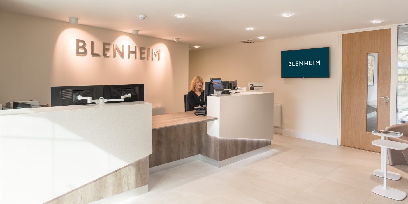 The reception desk in the Blenheim Estate Office, with the Blenheim name on the wall behind