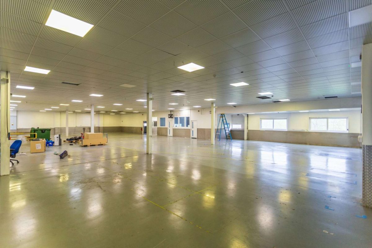 Large open industrial floor at Brook Hill with a polished floor and supporting columns