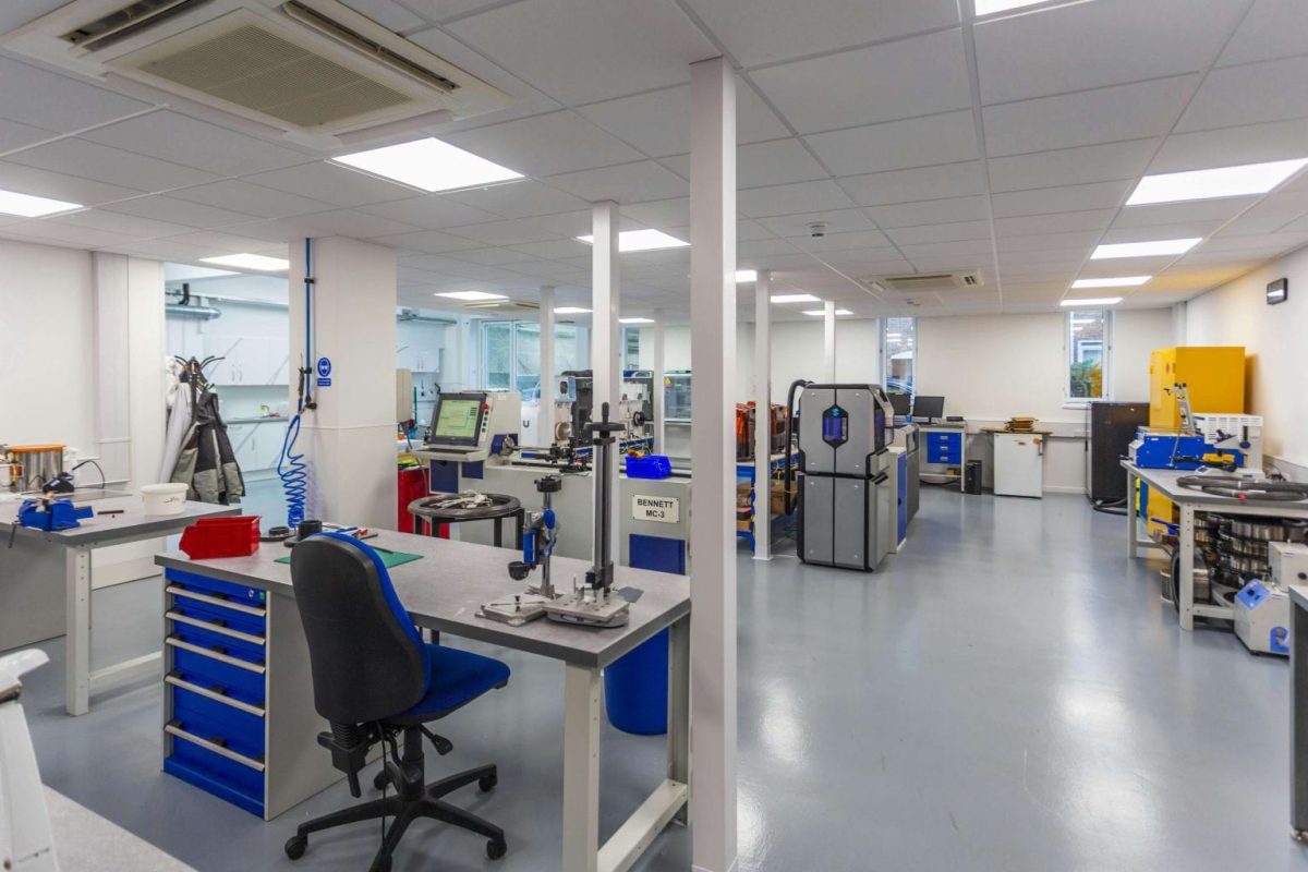 Workshop at Brook Hill with workbenches, blue tool cabinets and machinery