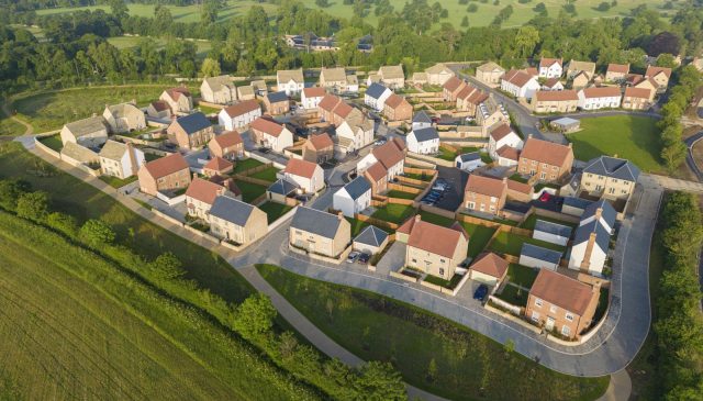 Aerial view of Park View homes on the edge of Woodstock, with Blenheim Park beyond