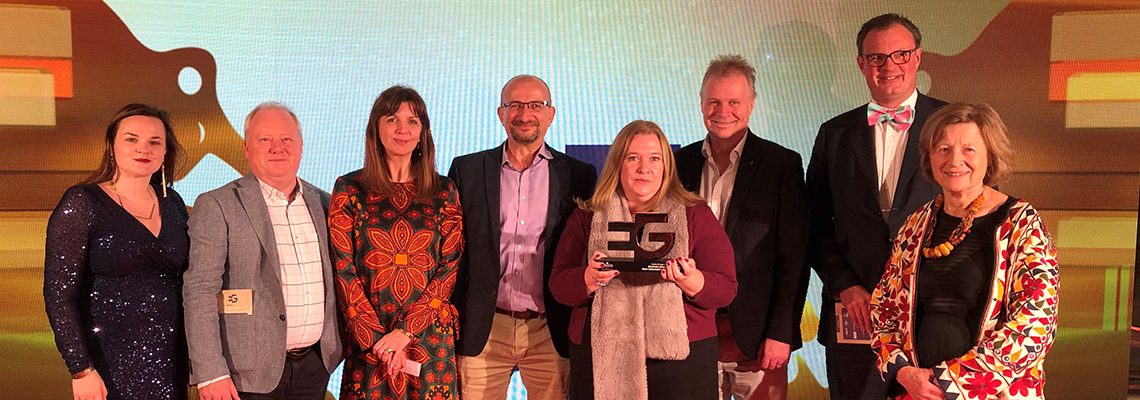 Eight people from Blenheim Estate and West Oxfordshire District Council on stage with their Estates Gazette Award