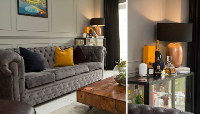 The Coopers' living room with a grey Chesterfield sofa, mustard cushions and a drinks cabinet